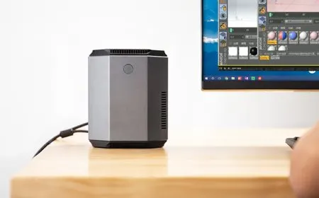 The device is a compact HaxMini computer powered by Intel Kaby Lake-G processing and housed in a speaker-sized chassis.