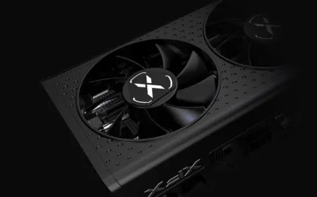 Three new XFX Radeon RX 6600 XT graphics cards are arranged side by side.