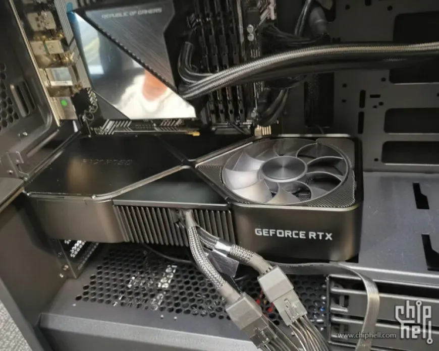 The NVIDIA GeForce RTX 3090 graphics card occupies three expansion slots inside a standard ATX case.