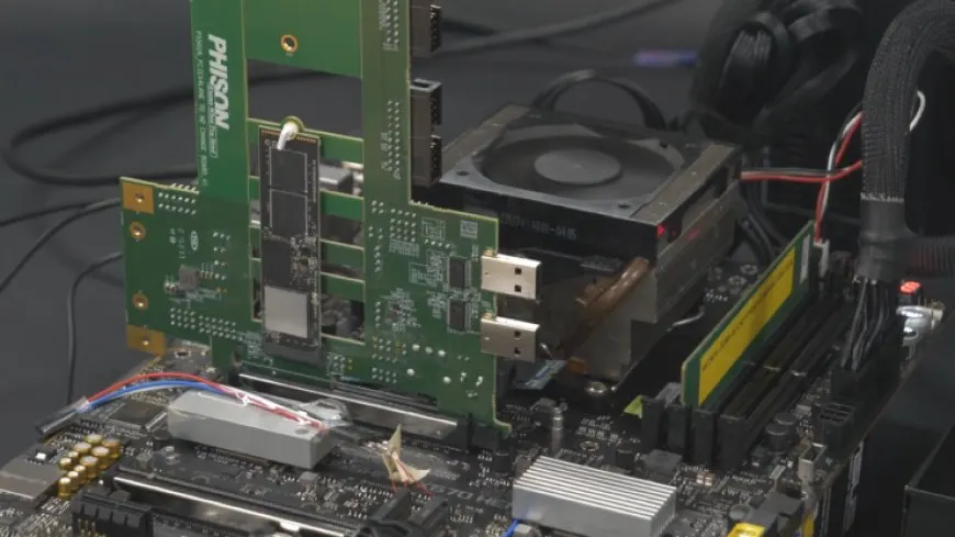 The Phison E26 PCIe Gen 5 SSD controller is installed on an ASUS ROG X670E HERO motherboard with an AMD Ryzen 7000 CPU.