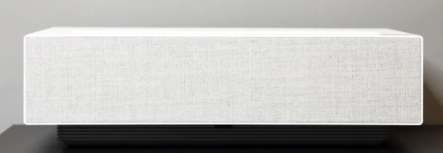 The LG HU715QW 4K UST projector sits on a stand.
