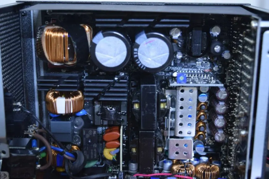 The FSP Hydro PTM PRO 1200W power supply is shown from the front with its modular connectors visible.