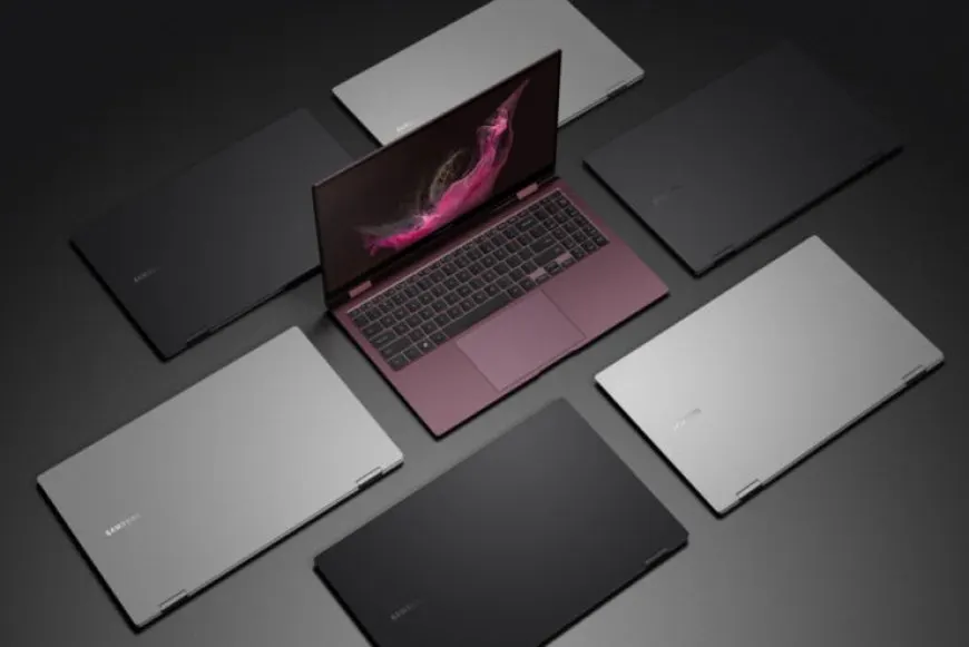 The Samsung Galaxy Book2 laptop is shown with a 32-inch Odyssey curved gaming monitor.