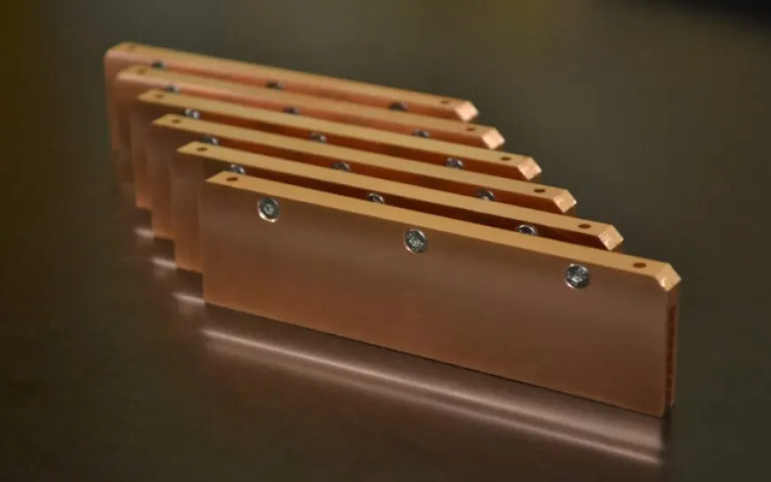 Custom all-copper DDR5 memory heatsinks are shown, designed for liquid nitrogen overclocking.