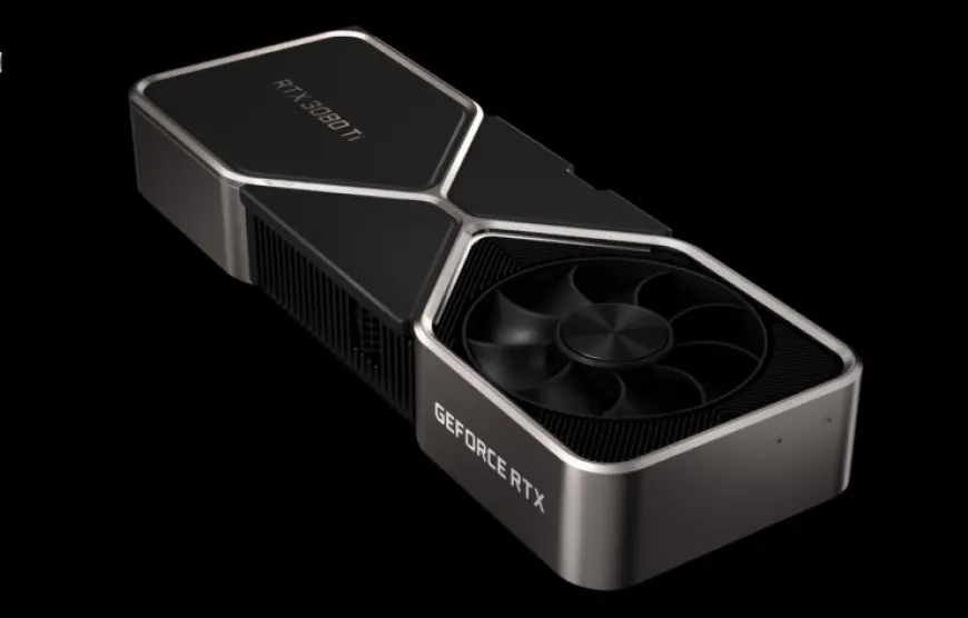 A graphics card with a black metal casing and dual cooling fans rests on a plain surface.