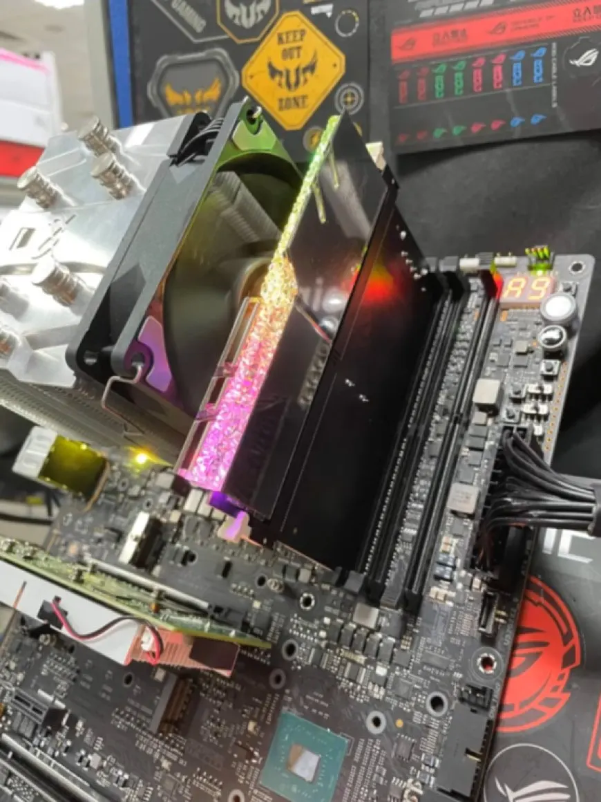 ASUS ROG DDR5 to DDR4 adapter board connected to a Z690 APEX motherboard during a working test.