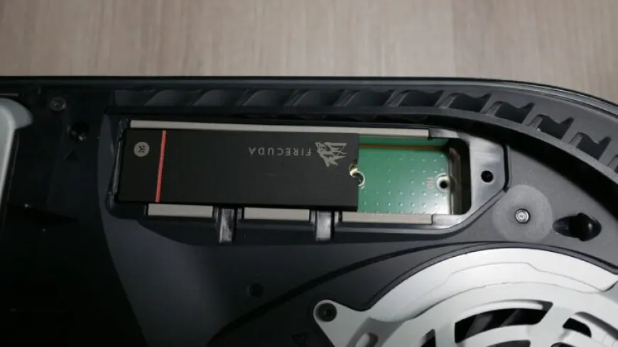 The PlayStation 5 internal drive bay is visible with an M.2 SSD ready for installation.