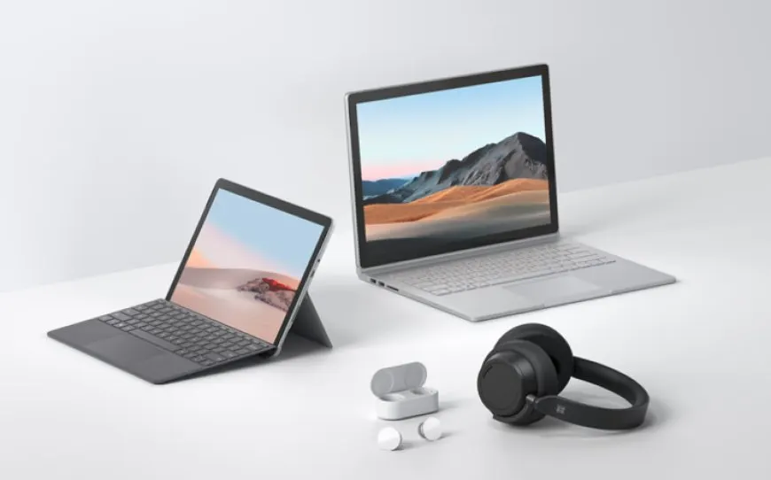Microsoft Surface laptops and Surface Pro devices are arranged for back-to-school shopping.