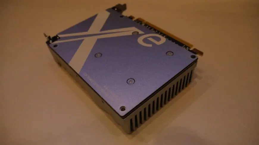 The Intel Xe-HPG DG2 graphics card board is shown with visible cooling components and connector ports.