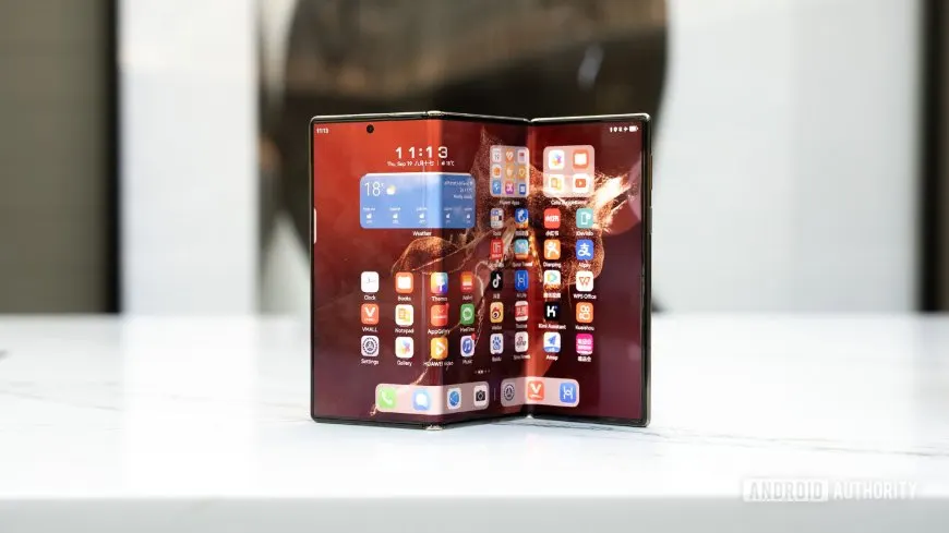 Huawei Mate XT triple-screen foldable phone shown in its fully expanded 10.2-inch configuration.