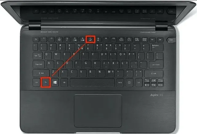 The Windows 11 touchpad settings window displays the disable toggle option.