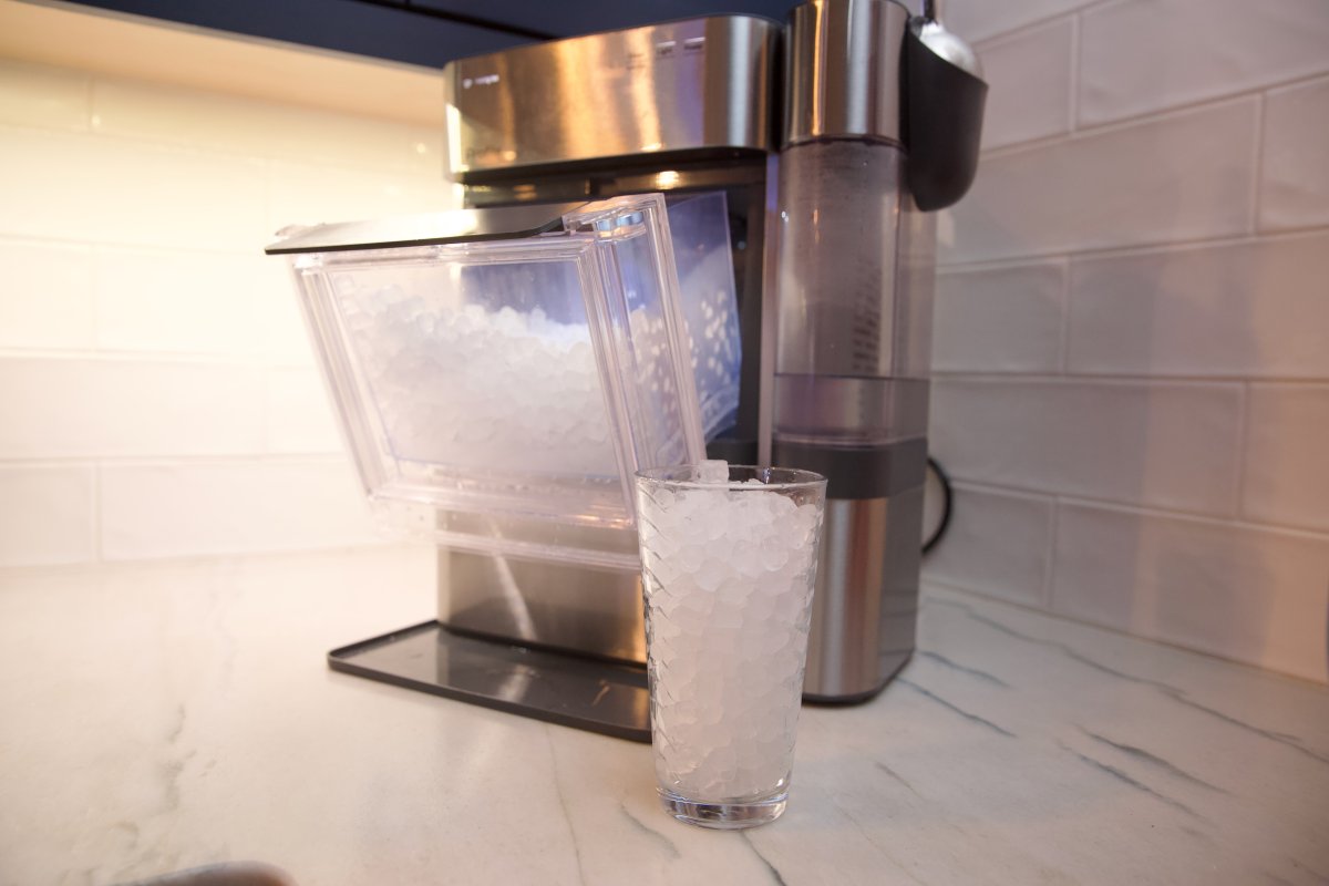 A white GE Profile Opal 2.0 Ultra Nugget Ice Maker sits on a countertop.