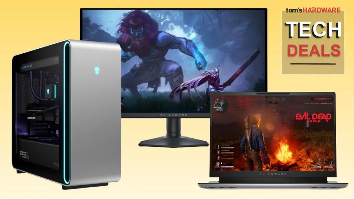 A retail display features Dell and Alienware laptops and monitors alongside promotional discount tags.