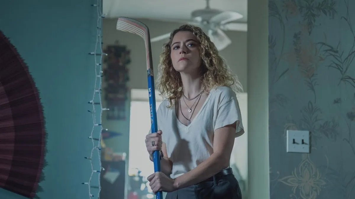 The promotional image shows Tatiana Maslany in a tense scene from the digital thriller series.