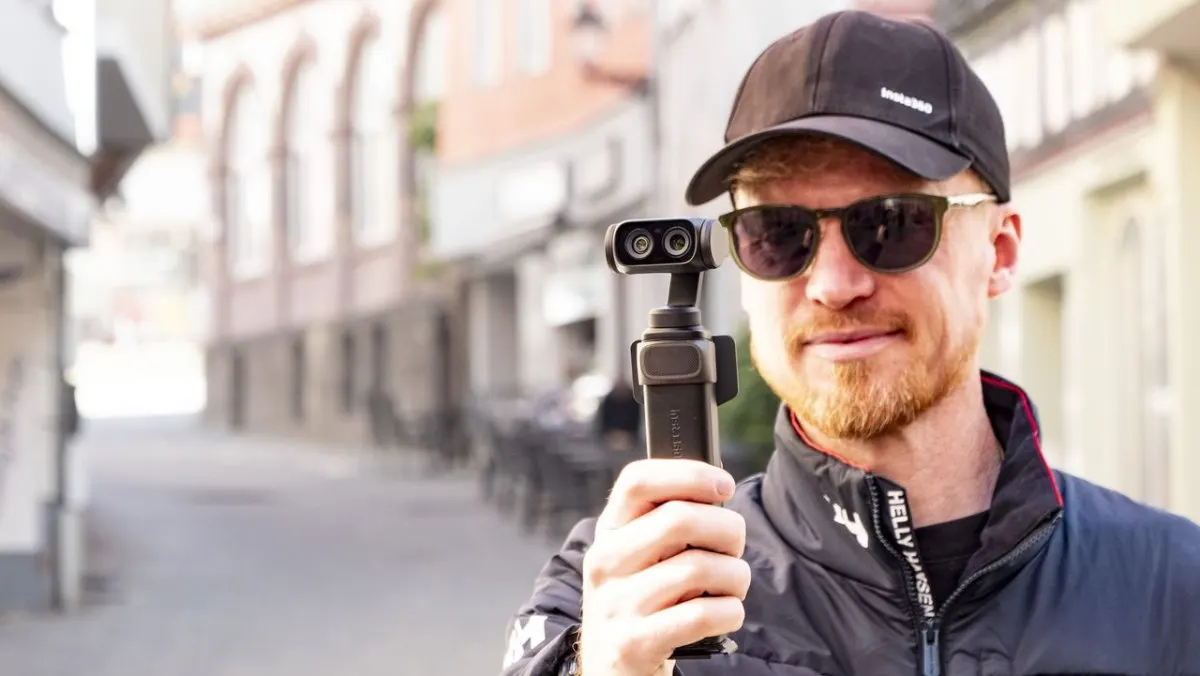 Insta360 Luna vlogging camera featuring a detachable screen, integrated microphone, and tracking controls.