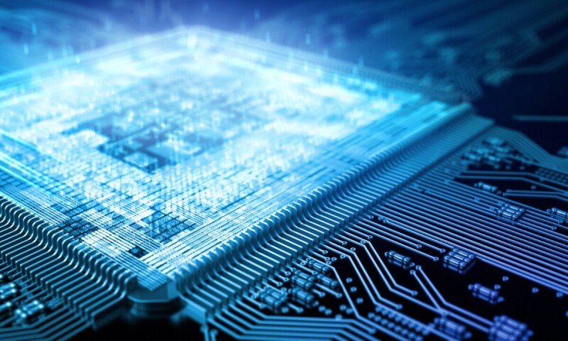 A close-up of a Huawei semiconductor chip revealing its intricate transistor layout.