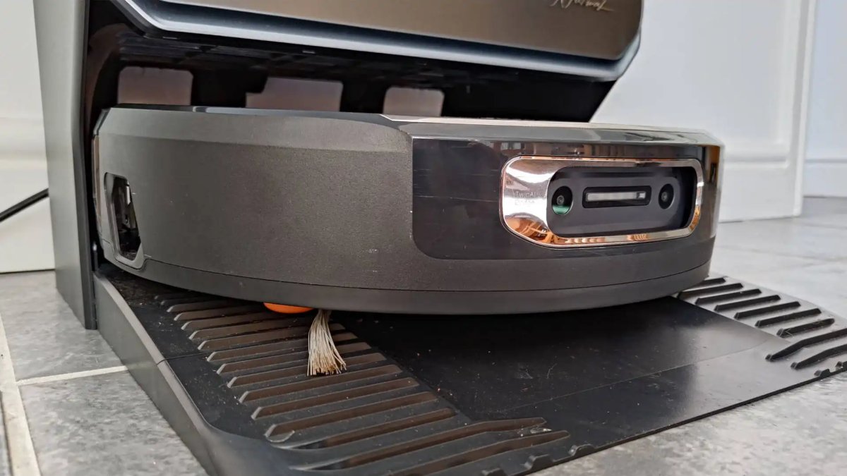 The Narwal Flow 2 robot vacuum and mop rests on a tiled floor.