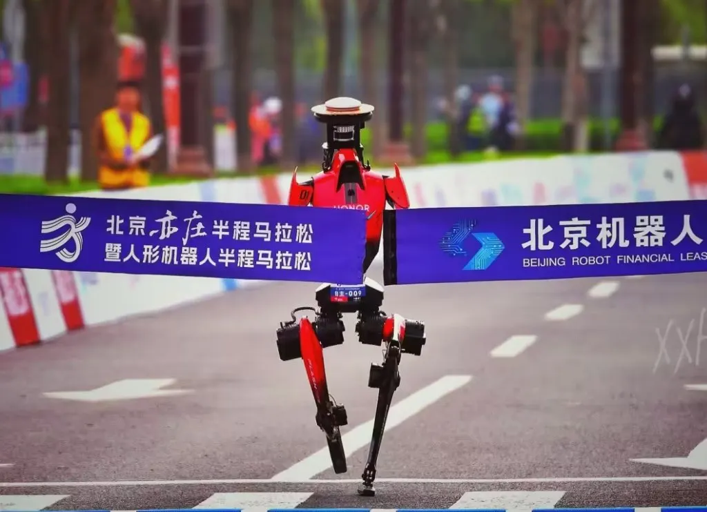 Honor's Flash humanoid robot running a half marathon in Beijing, finishing in fifty minutes and twenty-six seconds.