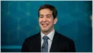 Okta stock chart and Q1 earnings data showing revenue beat and after-hours price jump