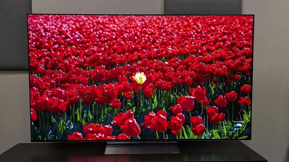 LG C6 OLED television displaying a sports broadcast with improved brightness and motion processing.