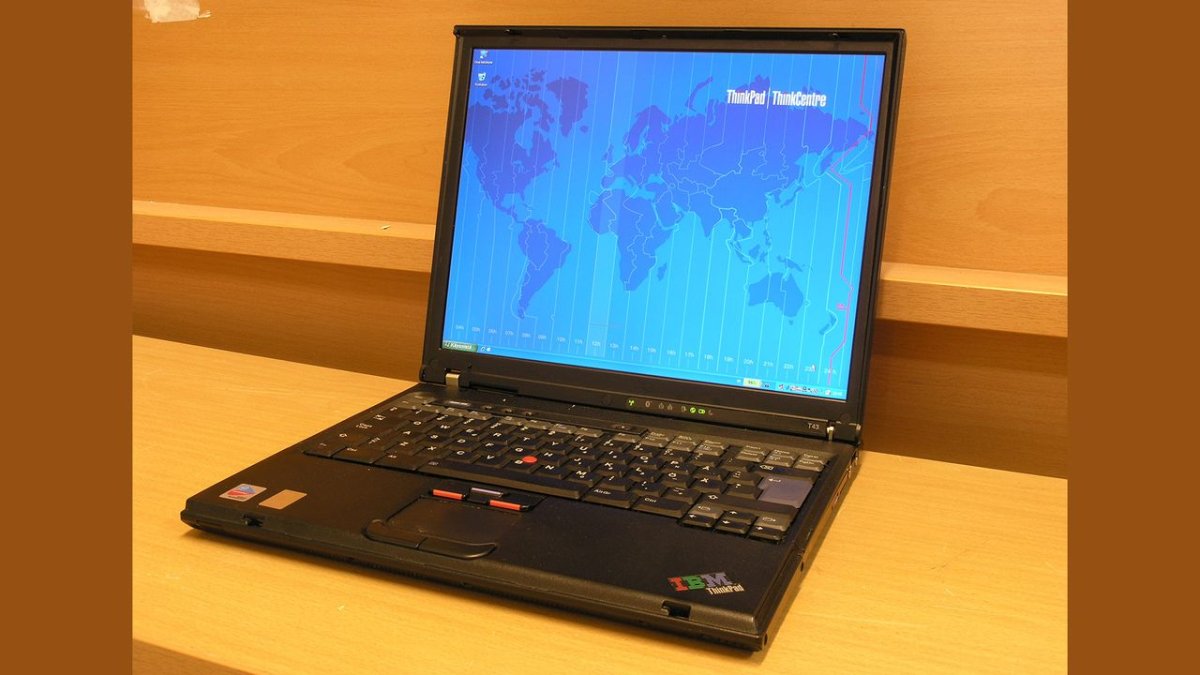 An IBM ThinkPad T43 laptop displays a Windows installation screen during a bare-metal setup process.