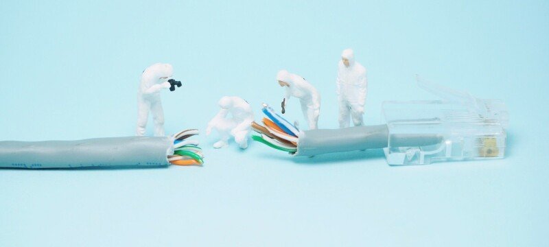 Routine maintenance damaged unprotected Ethernet cables near a mechanical winch.