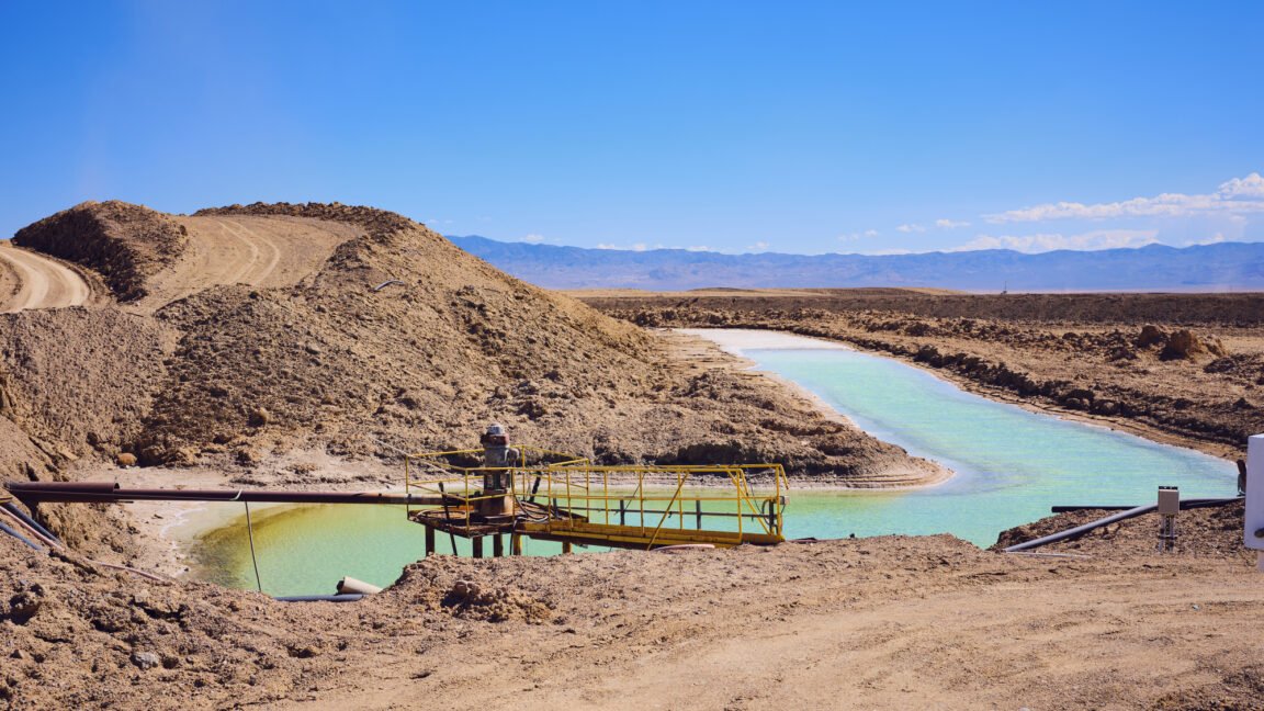 Laboratory equipment processes hard rock ore to extract lithium using an ammonium fluoride solution.
