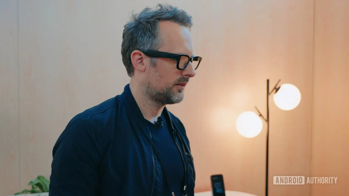 A person wearing modern smart glasses that combine contemporary eyewear styling with embedded technology.