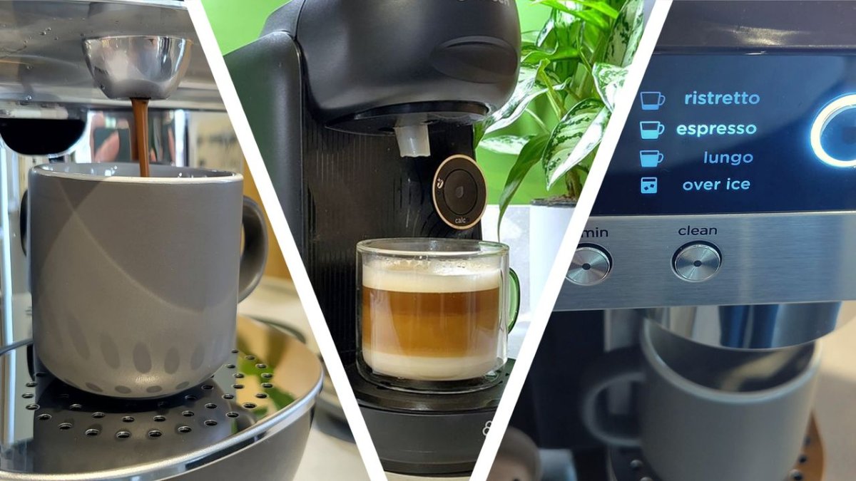 A capsule coffee machine brews a cup of coffee beside a stack of aluminum pods.