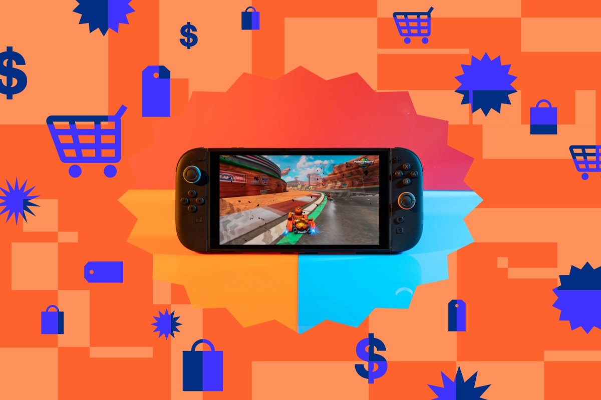 A Nintendo Switch gift card and console on a desk