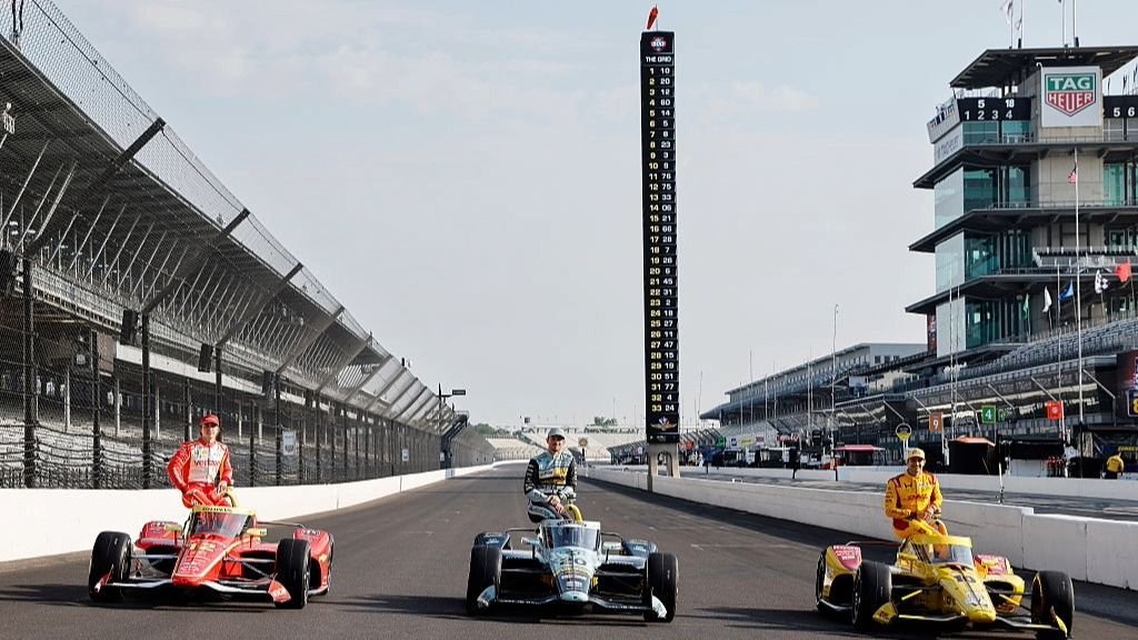 IndyCar drivers lined up on the starting grid for the 2026 Indianapolis 500