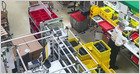 Employees use artificial intelligence tools to assist with daily tasks in a corporate and industrial workspace.