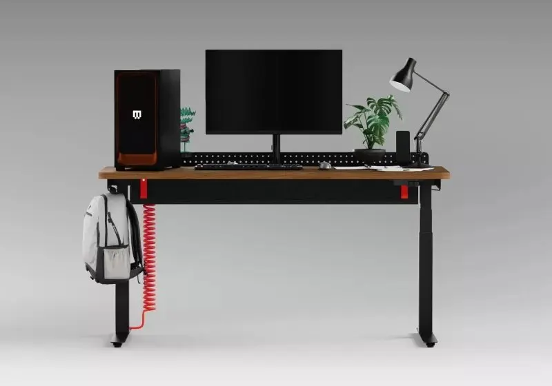 Herman Miller Coyl gaming desk with coiled red power cable and cable tray