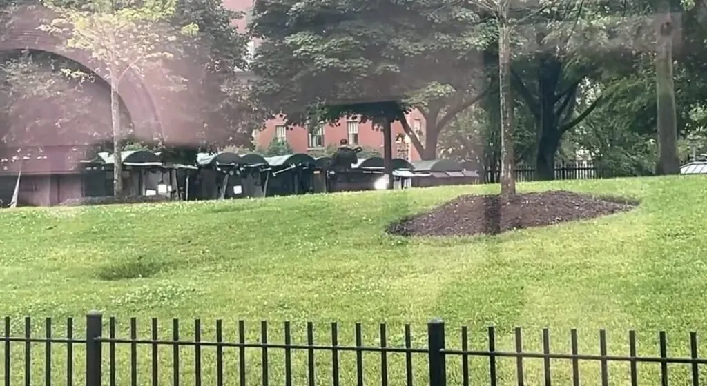 Police officers secure the White House perimeter following unconfirmed gunfire reports during diplomatic talks.