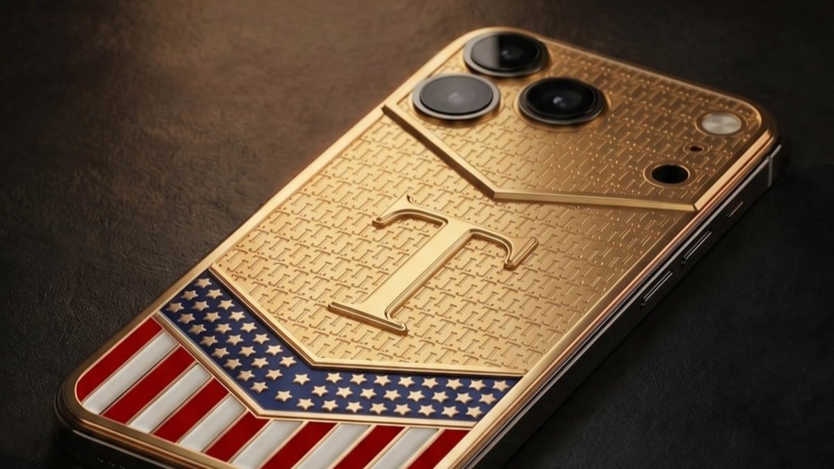 A gold-plated custom iPhone with political design elements rests on a display stand.