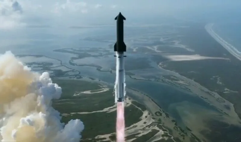 The SpaceX Starship rocket stands on the launchpad.