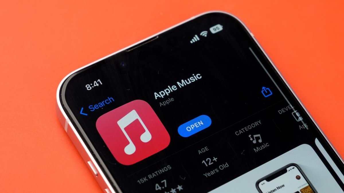 This graphic illustrates the Apple Music free tier announcement with ad-supported streaming and industry analysis.