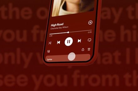 The Spotify mobile interface displays the new playlist folder feature for organizing music collections.