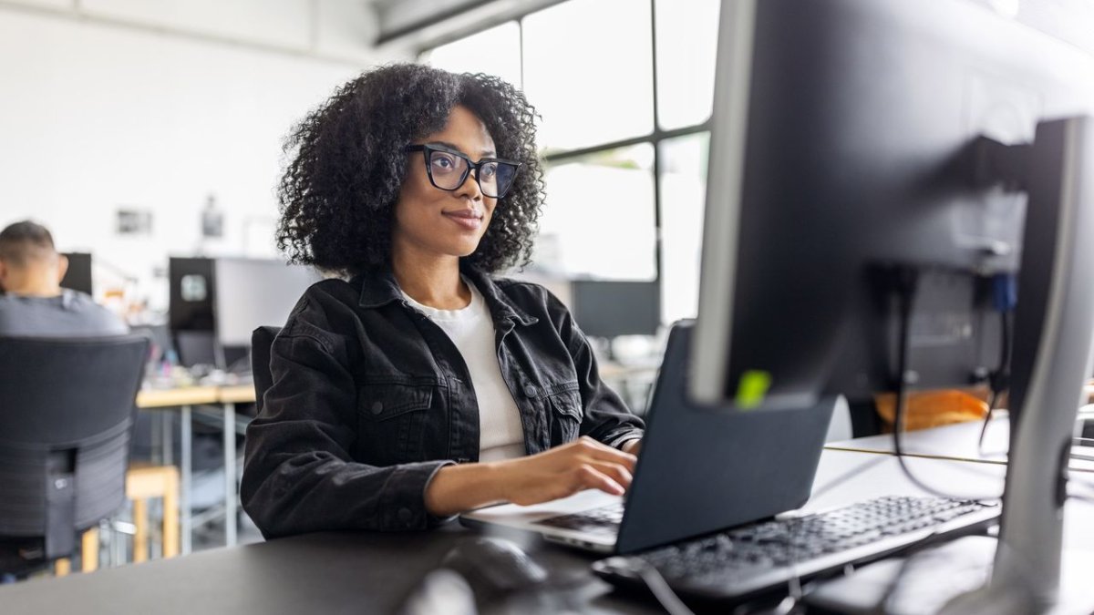Women and girls learning artificial intelligence skills in a collaborative workshop