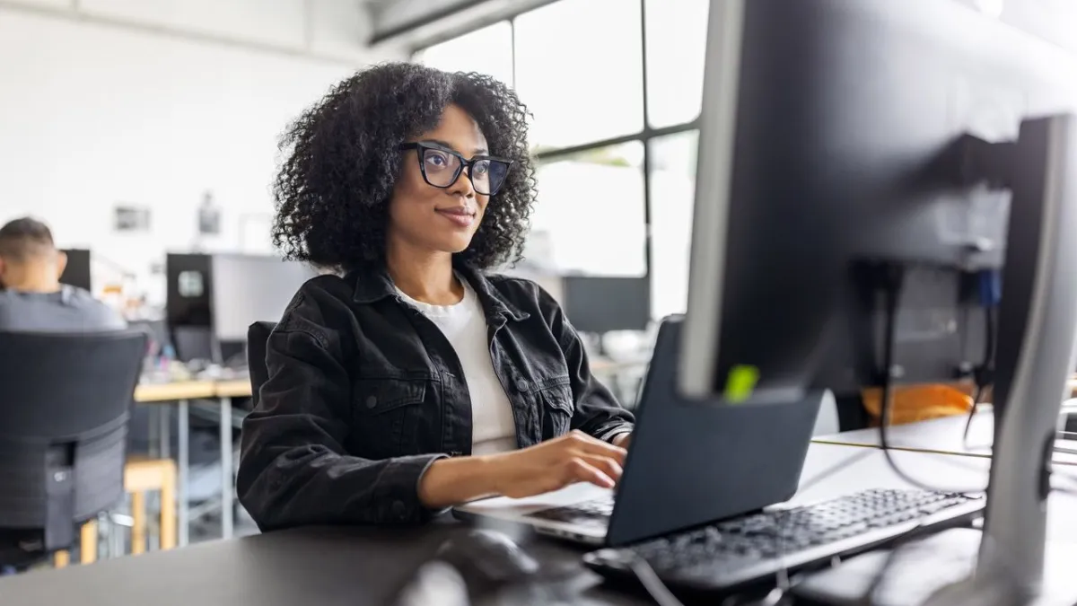 Women and girls learning artificial intelligence skills in a collaborative workshop