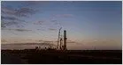 A SpaceX Falcon 9 rocket stands on the launch pad during daylight operations.