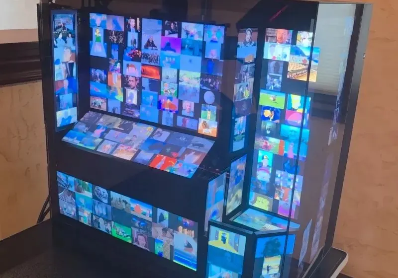 A custom gaming PC features 13 internal screens and displays 15,000 looping GIFs.
