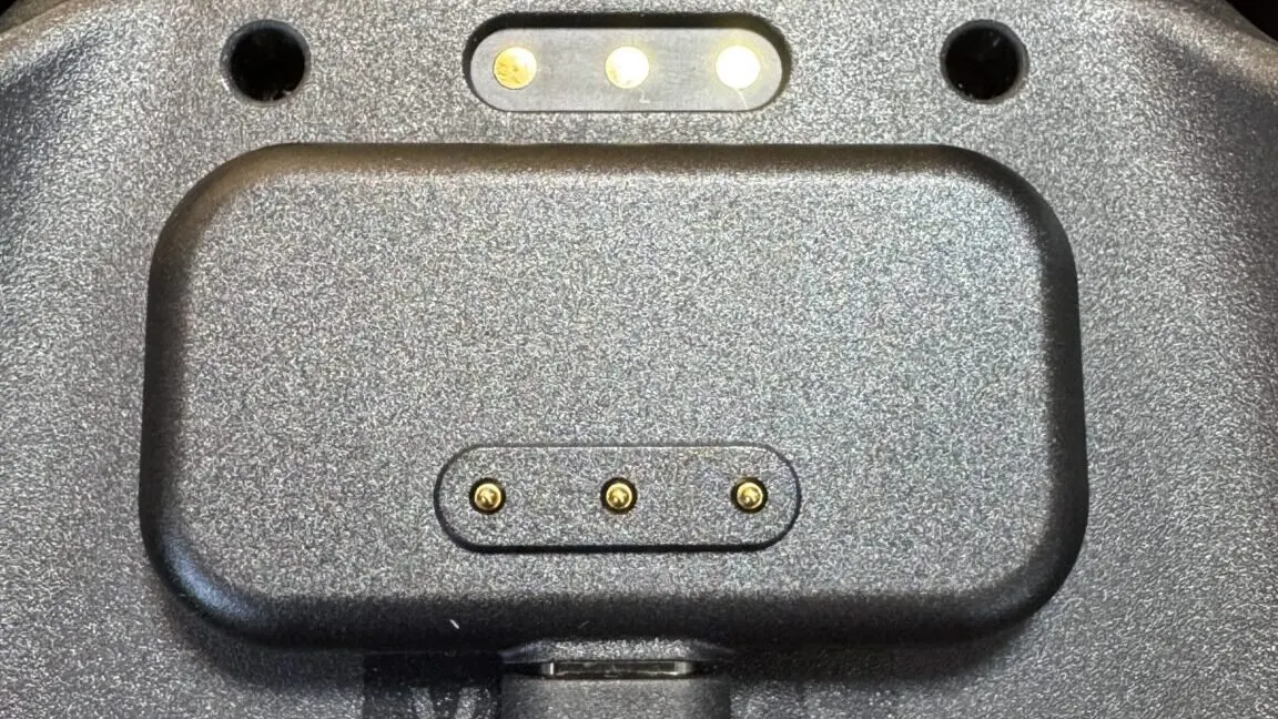 The magnetic charging puck for the Steam Controller displays exposed metal contact points.