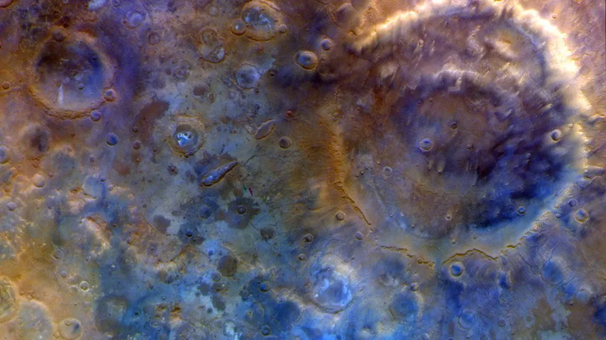 Mars surface showing Huygens crater and southern polar ice fields captured by the Psyche spacecraft during its gravity ass...