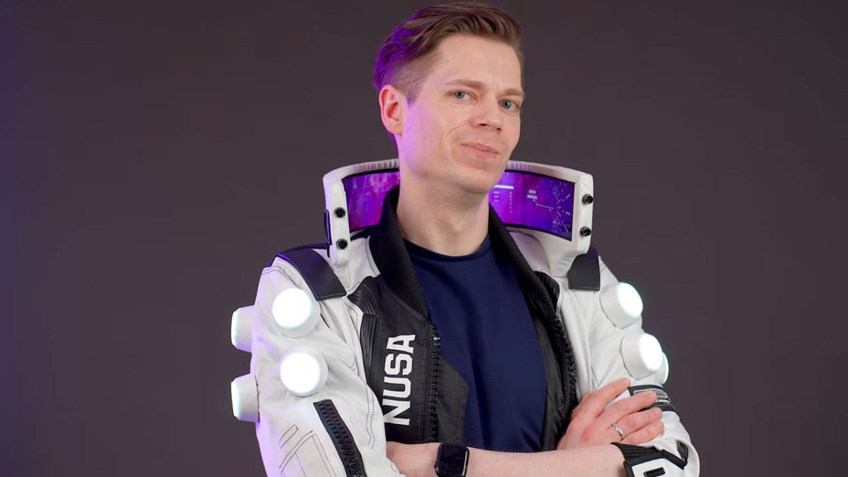 The tall collar of a NUSA Infiltrator cosplay jacket displays four flexible OLED panels powered by dual Raspberry Pi 4 boa...