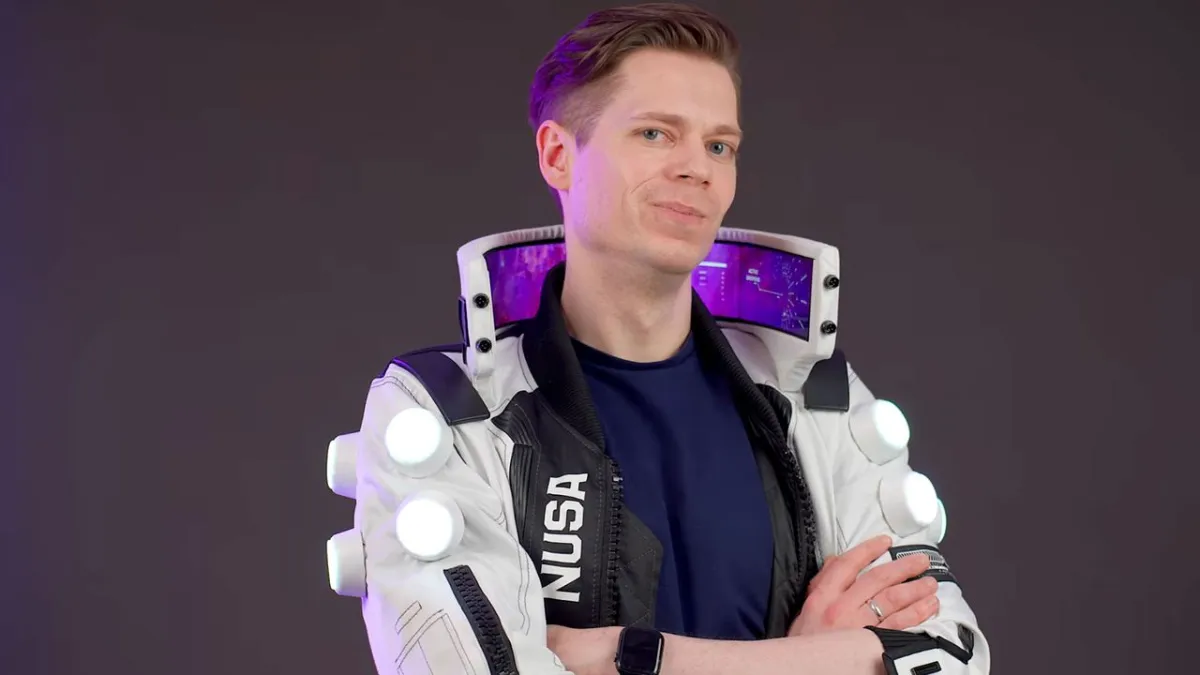 The tall collar of a NUSA Infiltrator cosplay jacket displays four flexible OLED panels powered by dual Raspberry Pi 4 boa...