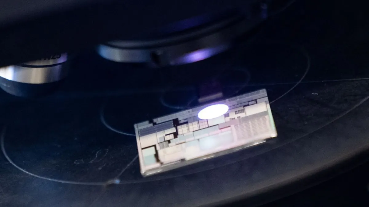 Human engineers oversee artificial intelligence systems verifying semiconductor chip designs.