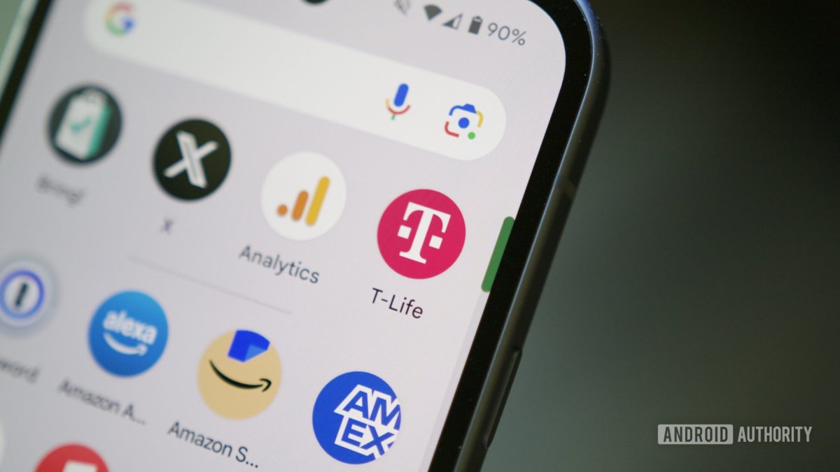 Customer using a smartphone app at a T-Mobile retail store counter