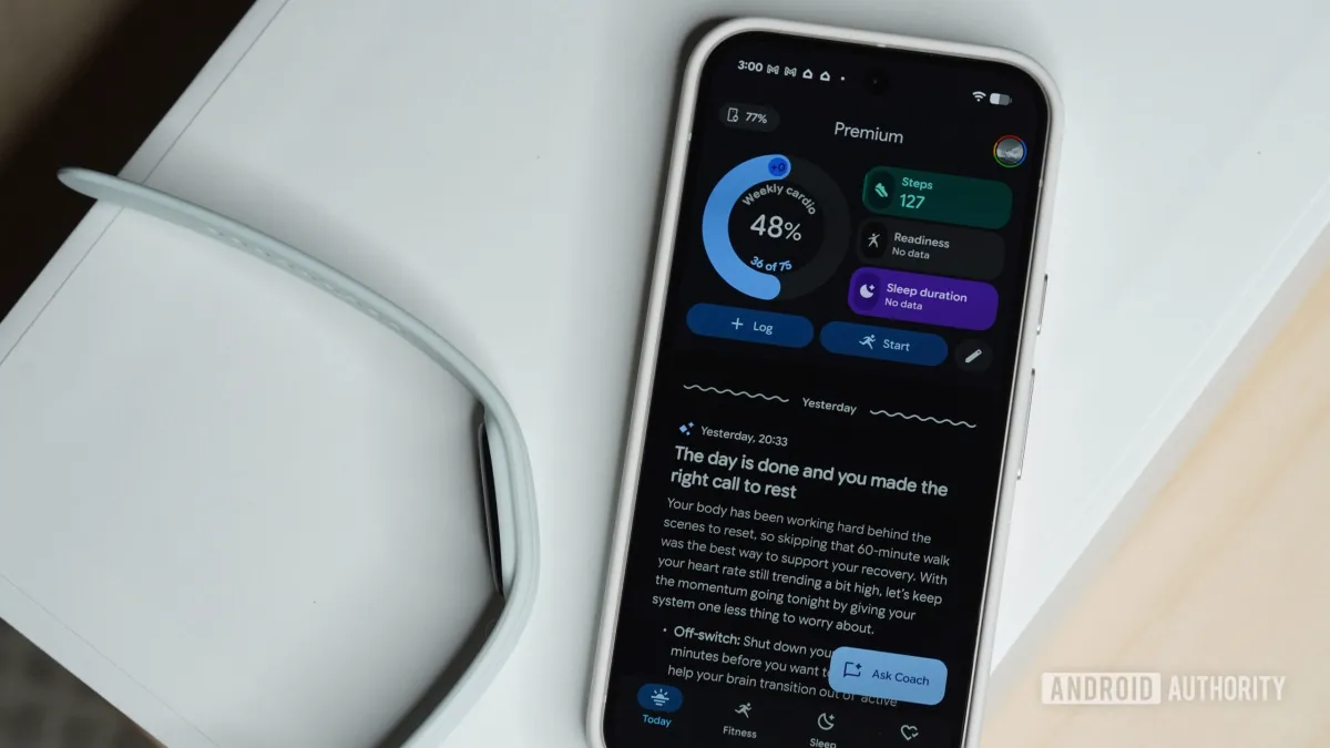 Google Fitbit Air smartwatch and smartphone displaying Android app pairing status screen