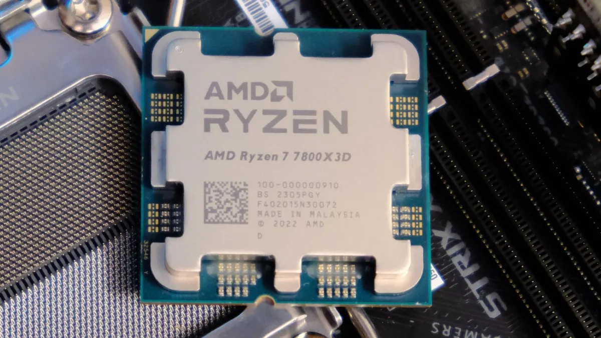 A close-up view displays the AMD Ryzen 7 7800X3D processor with its integrated heat spreader clearly visible.